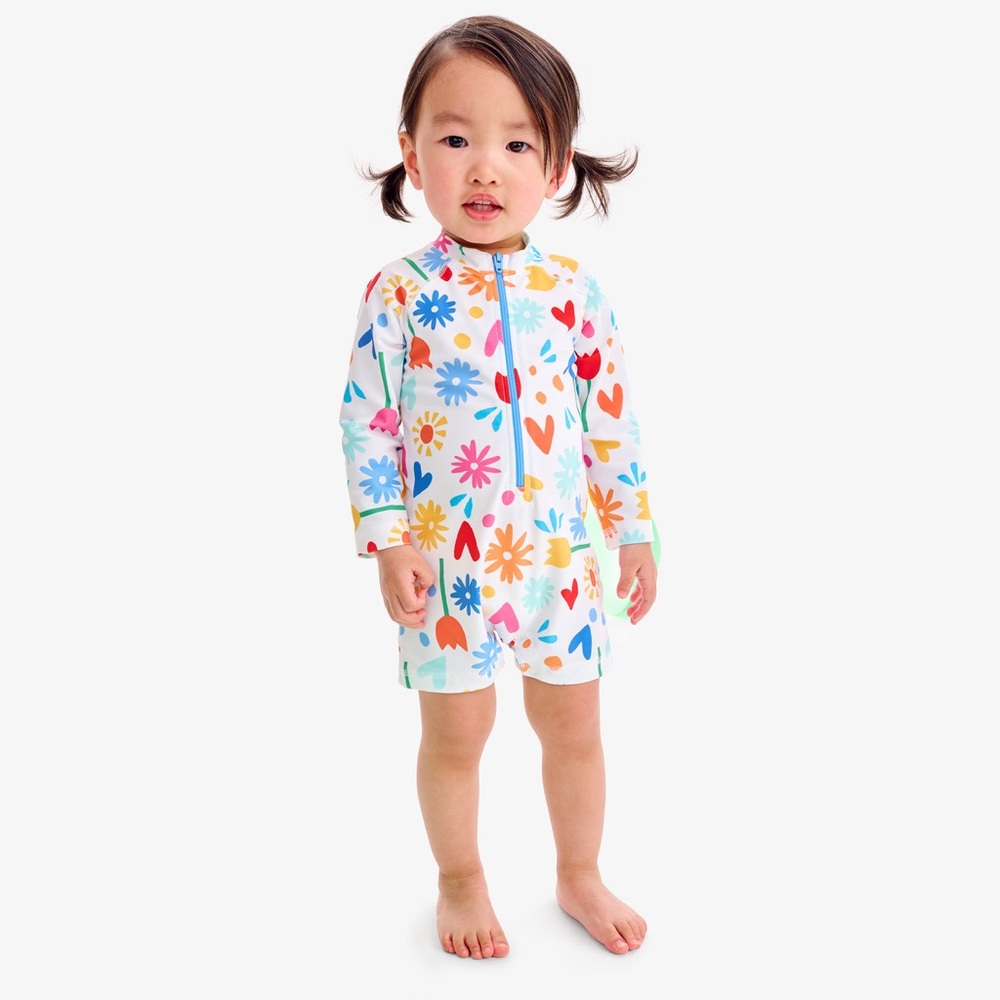 Primary baby one-piece rash guard in rainbow garden party